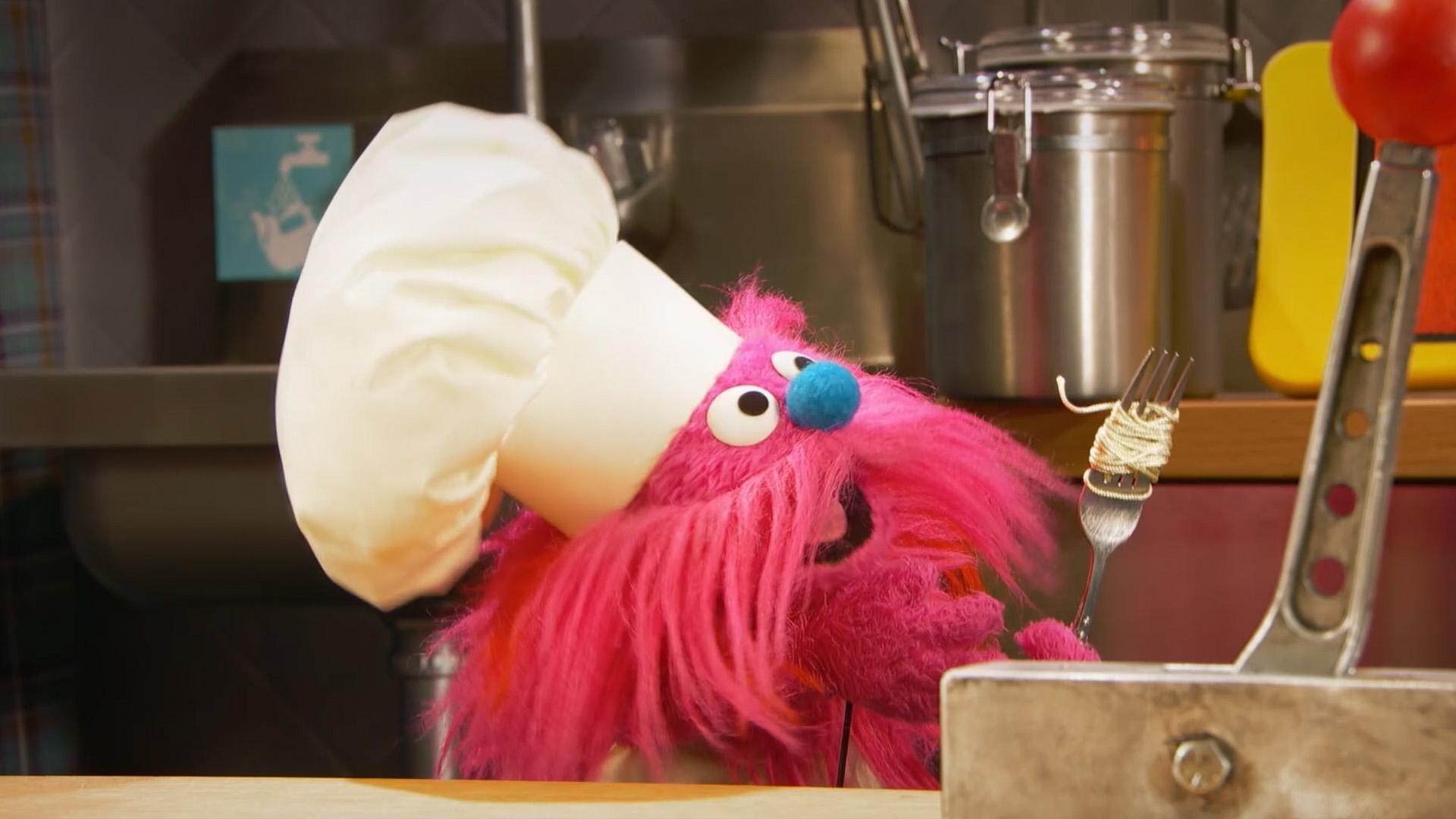 Gonger and Cookie Monster cook up some pasta in the Monster Foodie Truck.